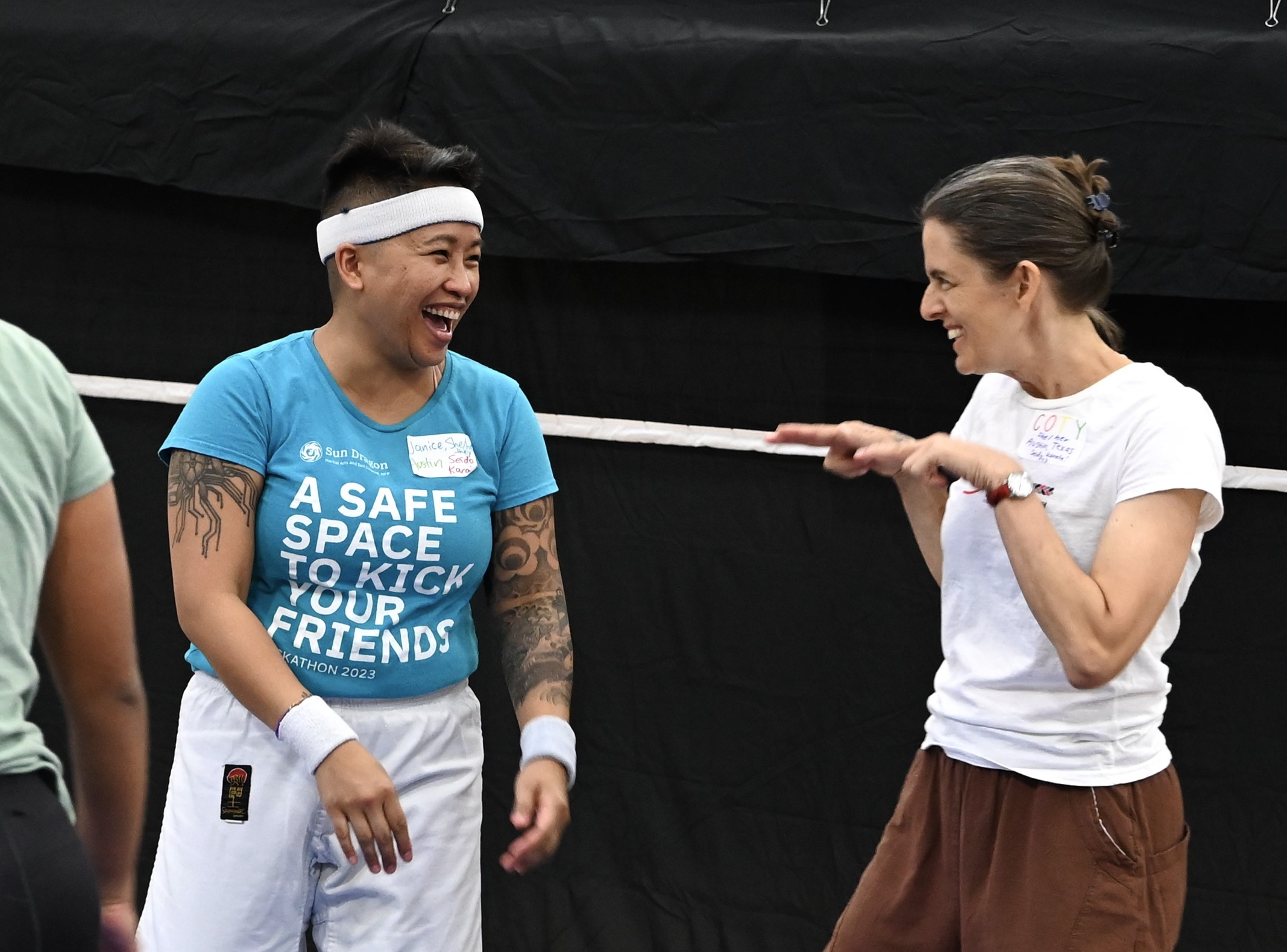 women martial artists training with knives
