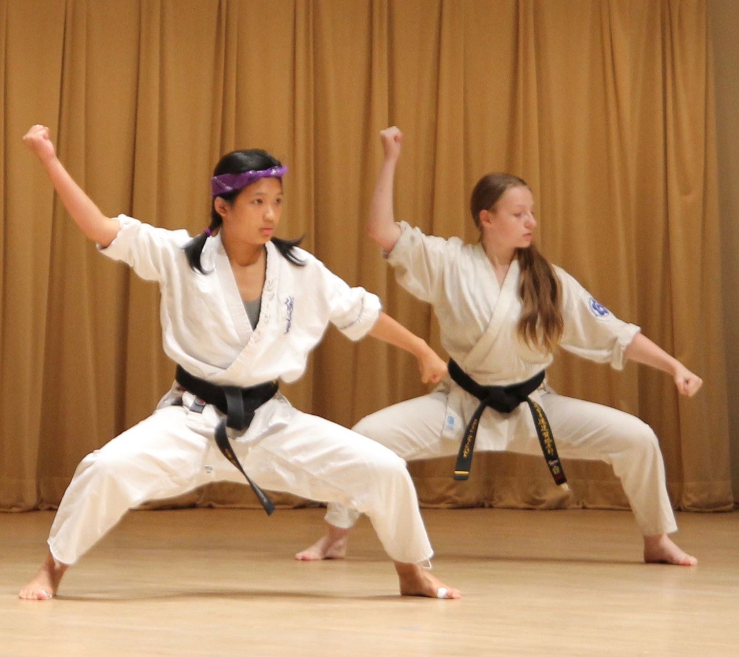 two youth performing a karate form in the super Saturday Showcase. 